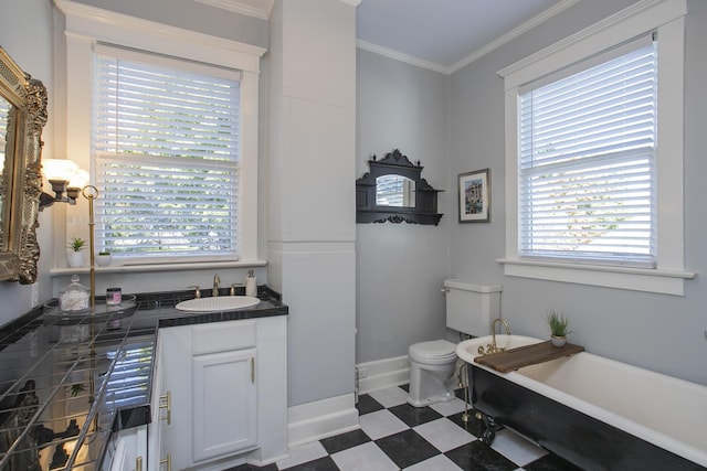 bathroom with toilet, ornamental molding, a tub to relax in, and vanity