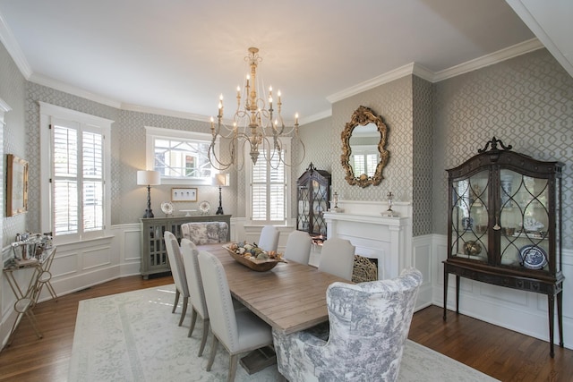 dining space featuring an inviting chandelier, dark hardwood / wood-style flooring, and ornamental molding