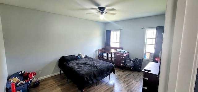 bedroom featuring ceiling fan and dark wood-type flooring