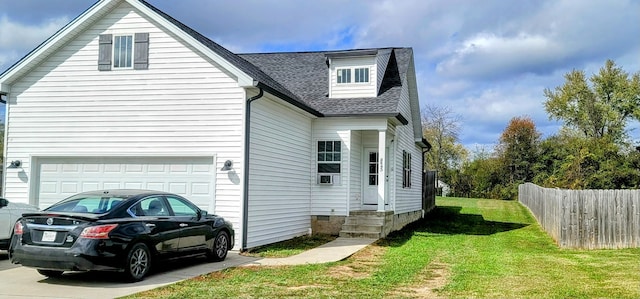 view of property exterior featuring a yard and a garage