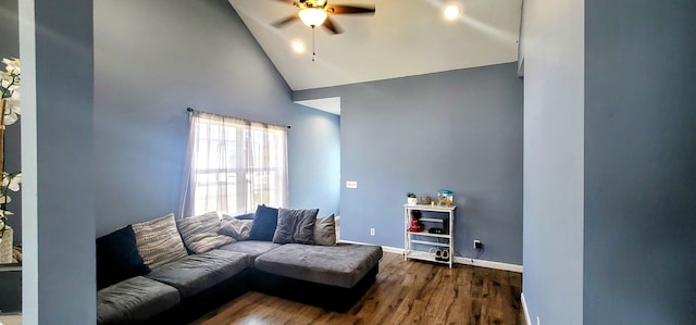 living room featuring ceiling fan, dark wood-type flooring, and high vaulted ceiling