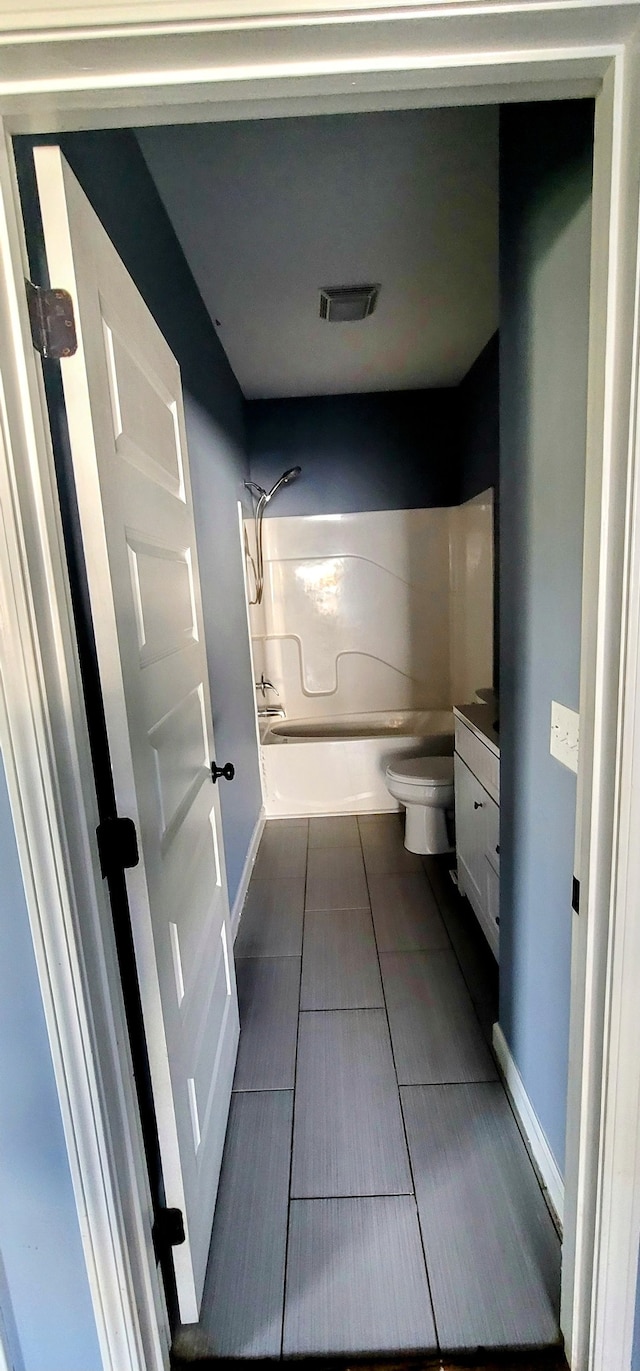 full bathroom featuring shower / washtub combination, vanity, and toilet