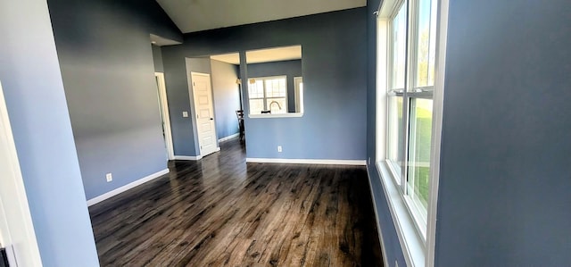 empty room featuring dark wood-type flooring