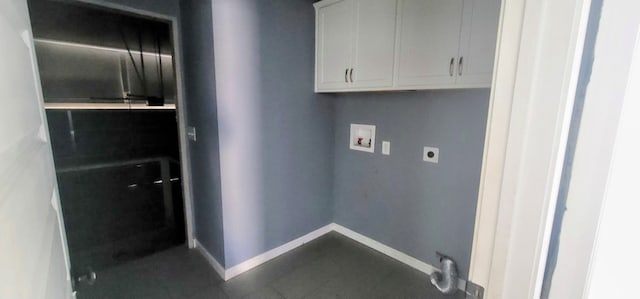 laundry area featuring cabinets, hookup for a washing machine, and electric dryer hookup