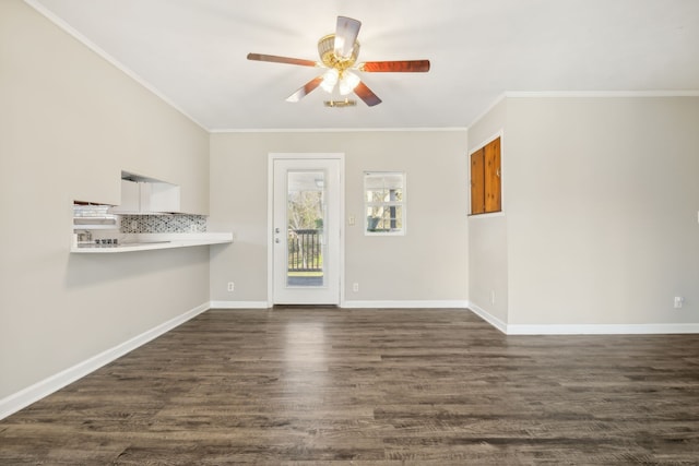 unfurnished room with crown molding, dark hardwood / wood-style floors, and ceiling fan