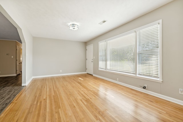 unfurnished room with light hardwood / wood-style floors