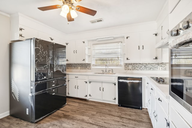 kitchen featuring stainless steel appliances, sink, and white cabinets