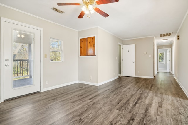 unfurnished living room featuring crown molding, ceiling fan, wood-type flooring, and plenty of natural light