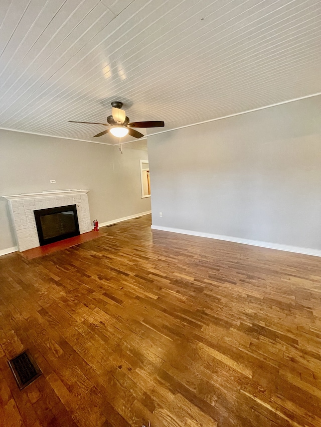 unfurnished living room featuring ceiling fan and hardwood / wood-style floors