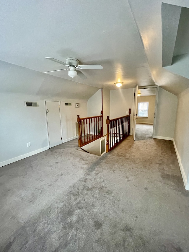 bonus room with carpet floors, ceiling fan, and vaulted ceiling