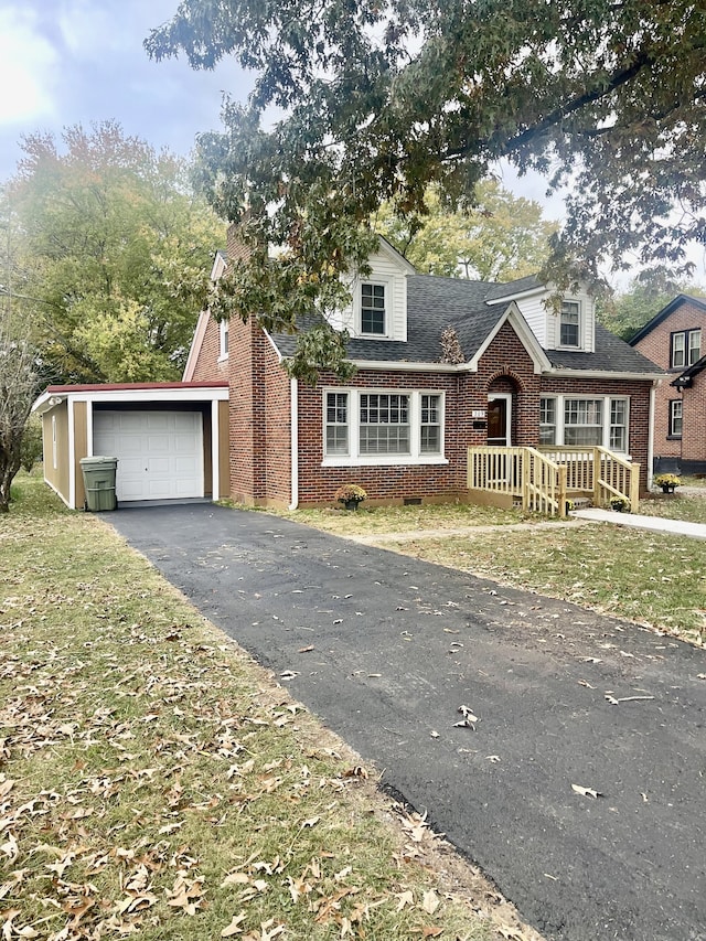 view of front of house with a front yard and a garage