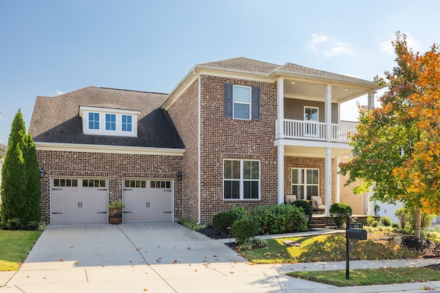 view of front of house with a balcony and a garage