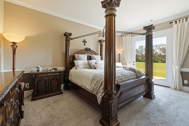 bedroom featuring ornamental molding, access to outside, and light colored carpet