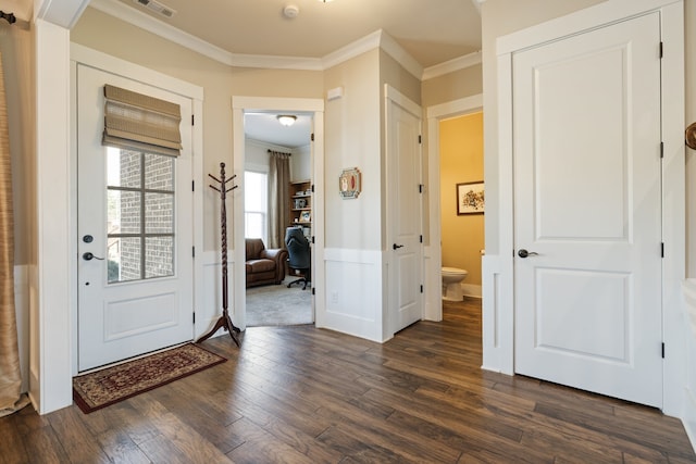 entryway with crown molding and dark wood-type flooring