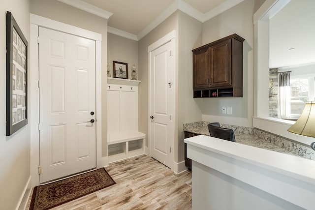 mudroom with crown molding and light hardwood / wood-style flooring