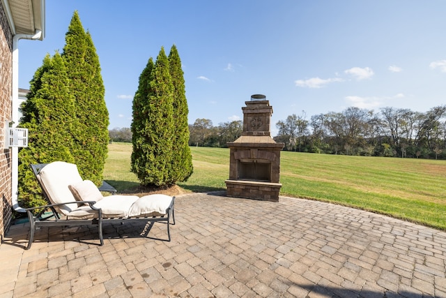 view of patio featuring an outdoor fireplace