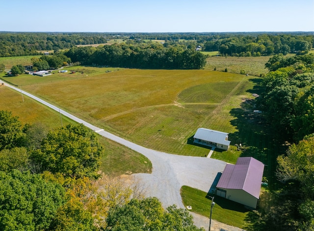 birds eye view of property with a rural view