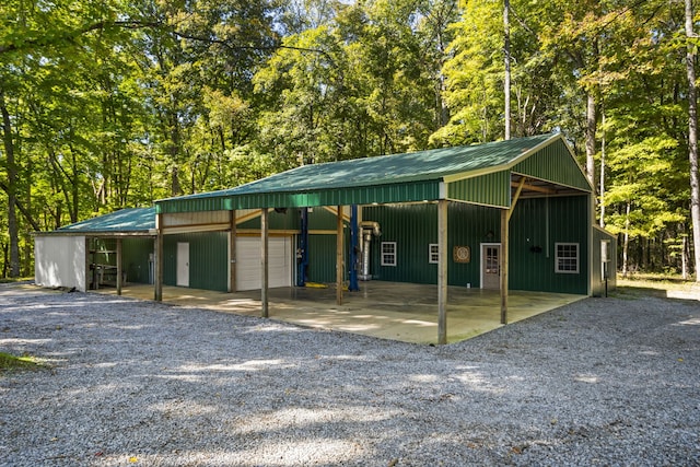 view of front of home featuring an outbuilding