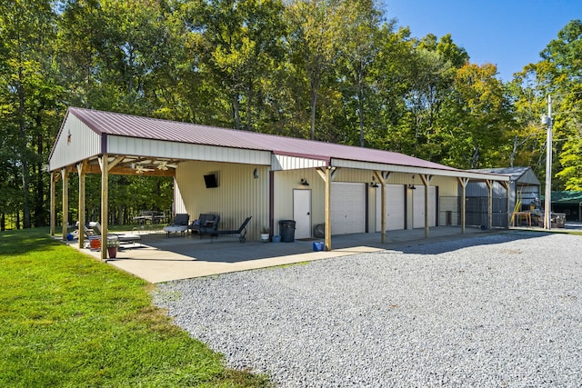 exterior space featuring a carport and a lawn