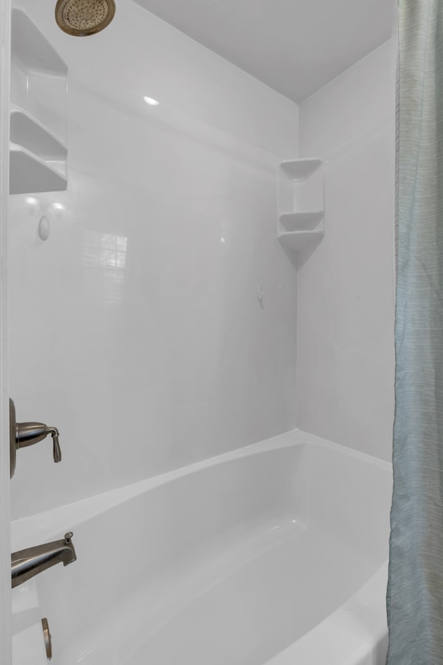 bathroom with shower / tub combo with curtain