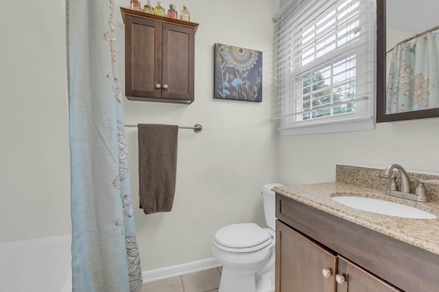 bathroom with toilet, curtained shower, vanity, and tile patterned flooring