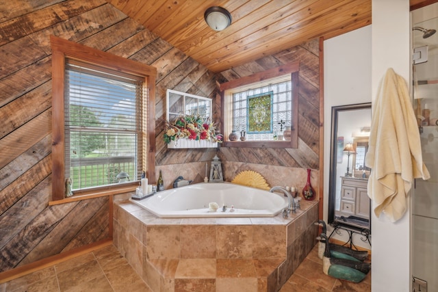 bathroom featuring wood ceiling, tiled bath, tile patterned floors, lofted ceiling, and vanity