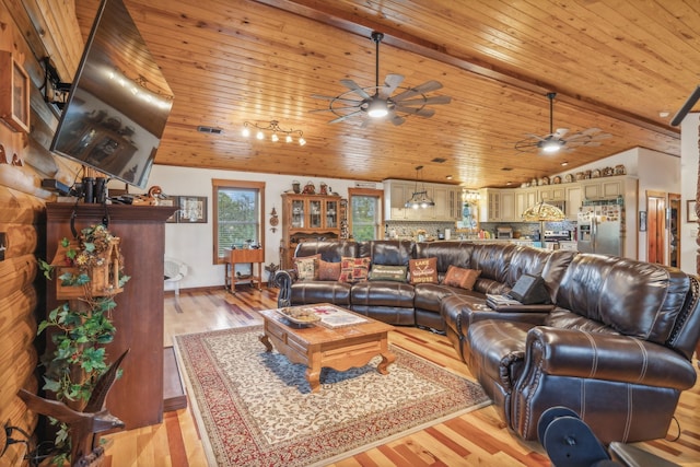 living room with light hardwood / wood-style flooring, ceiling fan, wood ceiling, and vaulted ceiling