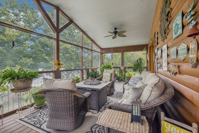 sunroom / solarium with a wealth of natural light, vaulted ceiling, and ceiling fan