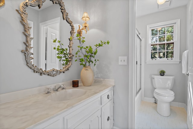 full bathroom with toilet, vanity, shower / bath combination with glass door, and tile patterned flooring