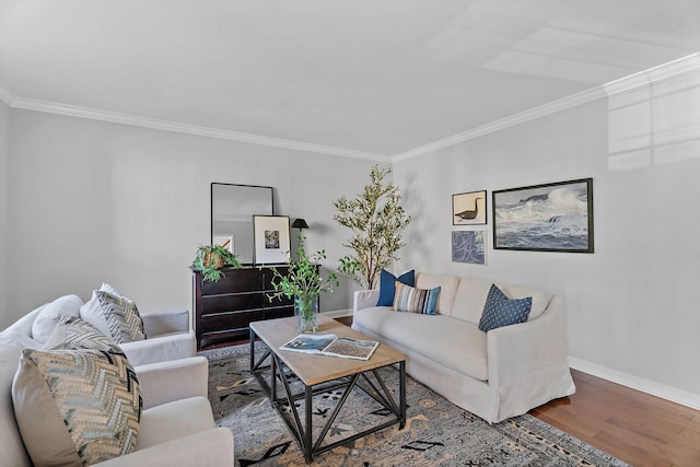 living room with hardwood / wood-style flooring and crown molding