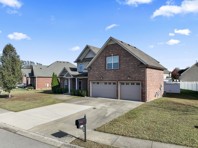 view of property featuring a front yard and a garage