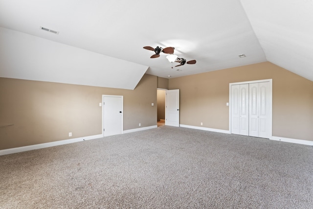 additional living space with ceiling fan, carpet flooring, and vaulted ceiling