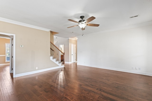 spare room with ornamental molding, dark wood-type flooring, and ceiling fan