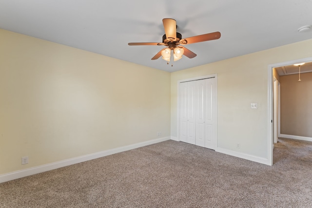 unfurnished bedroom featuring a closet, carpet flooring, and ceiling fan