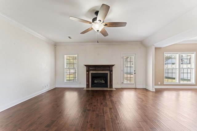 unfurnished living room with ceiling fan, dark hardwood / wood-style flooring, plenty of natural light, and a fireplace