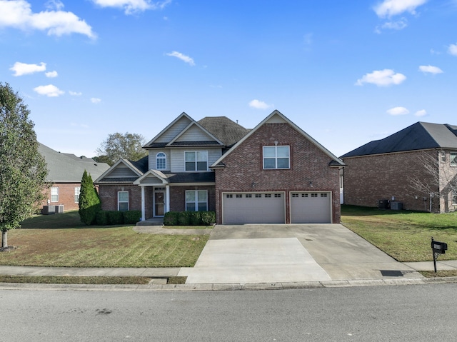 view of front of home featuring a front yard and a garage