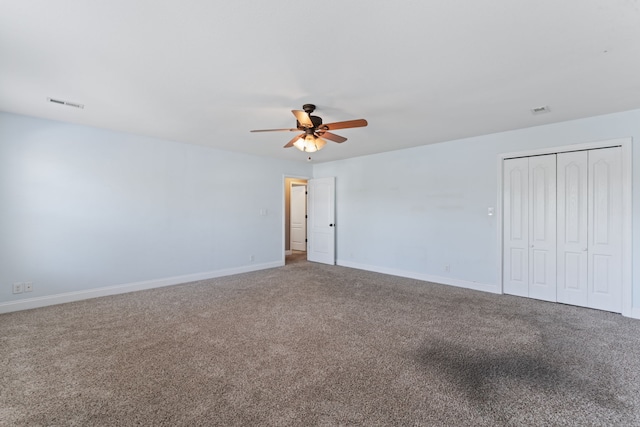 empty room with carpet and ceiling fan