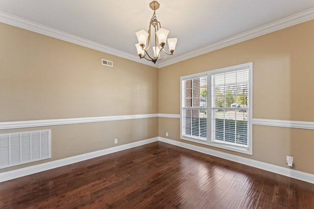 empty room with crown molding, dark hardwood / wood-style flooring, and a chandelier