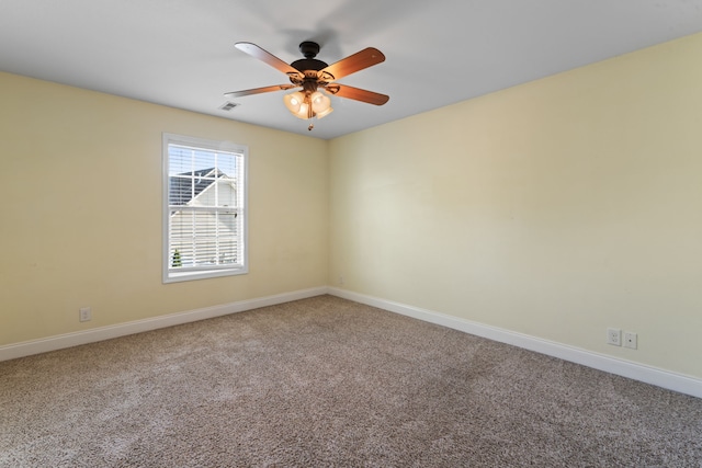 unfurnished room with carpet flooring and ceiling fan