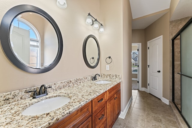 bathroom with vanity, tile patterned flooring, and an enclosed shower