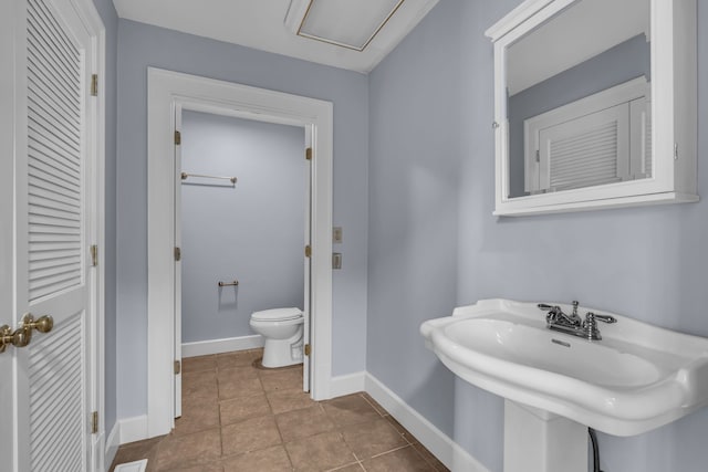 bathroom featuring tile patterned floors and toilet