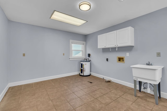 laundry area featuring cabinets, light tile patterned floors, hookup for a washing machine, water heater, and hookup for a gas dryer