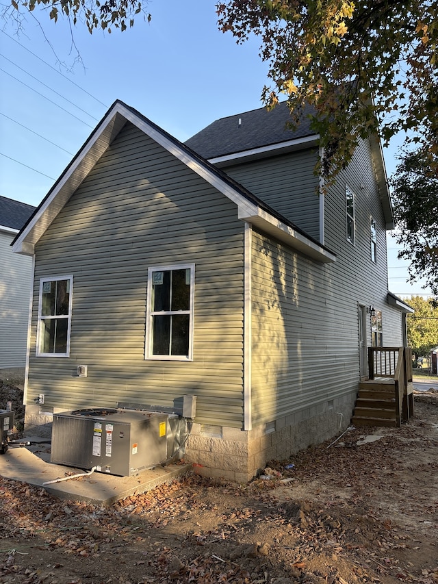 view of home's exterior with central AC unit