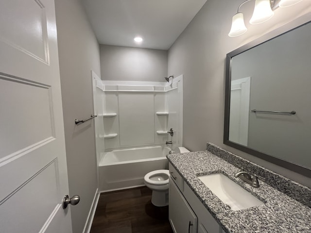 full bathroom with vanity, tub / shower combination, hardwood / wood-style floors, and toilet