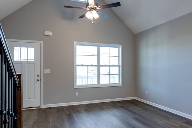 foyer with ceiling fan, high vaulted ceiling, and dark hardwood / wood-style floors