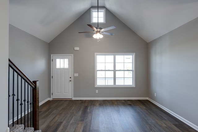 entryway with dark hardwood / wood-style floors, high vaulted ceiling, and ceiling fan