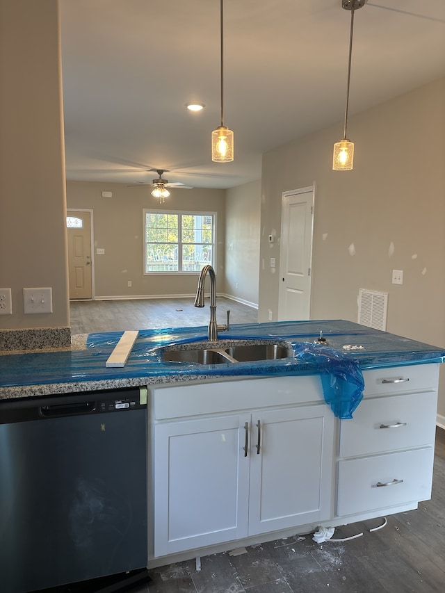 kitchen featuring dishwasher, dark wood-type flooring, sink, pendant lighting, and white cabinetry