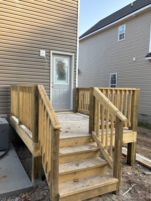 view of exterior entry featuring a deck