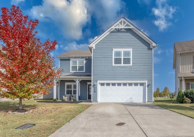 view of front facade with a garage and a front lawn