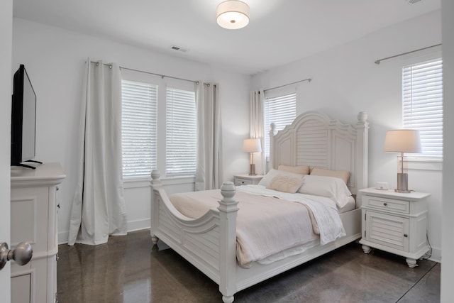 bedroom featuring multiple windows